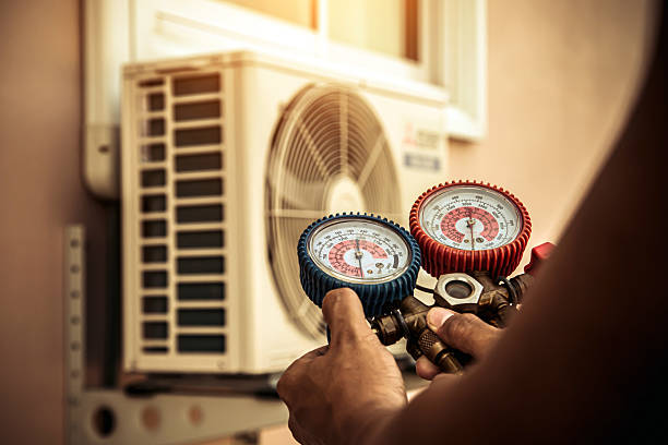 Professional Air Conditioning Service technician working in Maryville, IL